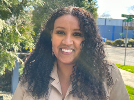Yordanos Gebreamlak, a woman with dark brown curly hair